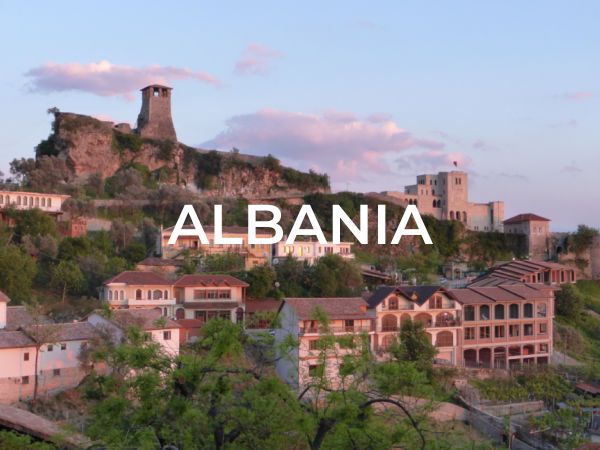 Category selection image that says "Albania" with a photo of a castle on a hill in Kruja, Albania.